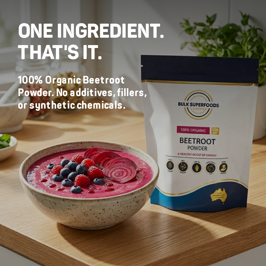 Bowl of a pink smoothie with beetroot powder and berries next to a package of Bulk Superfoods beetroot powder.